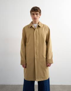 Model wearing Cord collar car coat in camel