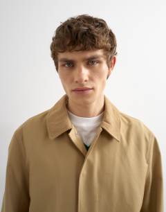 Model wearing Cord collar car coat in camel