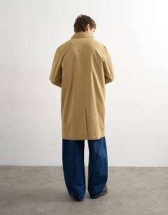 Model wearing Cord collar mac in camel