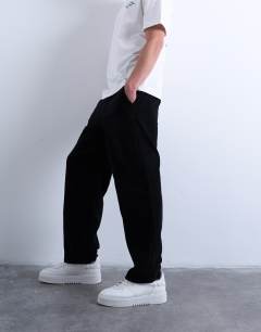 Model wearing Cord taper leg trousers in black