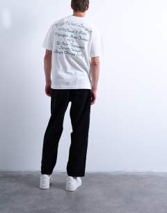 Model wearing Cord taper leg trousers in black