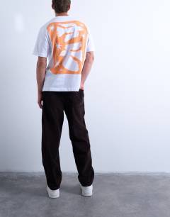 Model wearing Cord taper leg trousers in brown