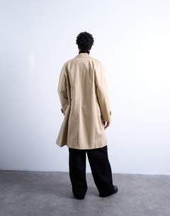 Model wearing Cotton mac in stone