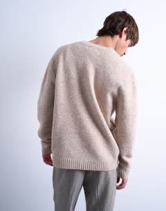 Model wearing Crew neck cardigan in stone