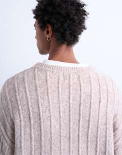 Model wearing Crew neck jumper in oat rib