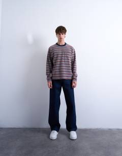 Model wearing Crop fit long sleeve t-shirt in multi stripe
