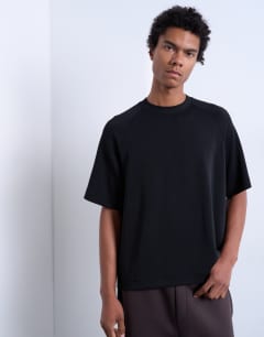 Model wearing Crop fit raglan tee in black