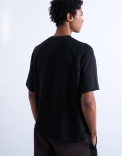 Model wearing Crop fit raglan tee in black