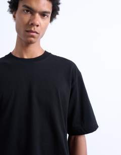 Model wearing Crop fit t-shirt in black