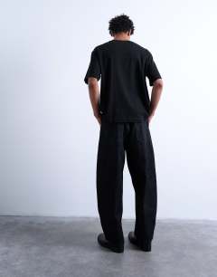 Model wearing Crop fit t-shirt in black