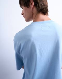 Model wearing Crop fit t-shirt in light blue