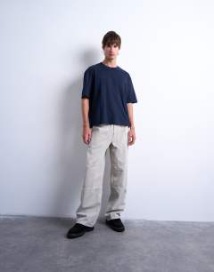 Model wearing Crop fit t-shirt in navy