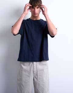Model wearing Crop fit t-shirt in navy