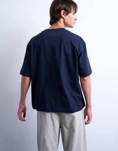 Model wearing Crop fit t-shirt in navy