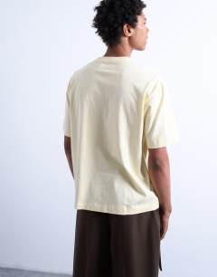 Model wearing Crop fit t-shirt in yellow
