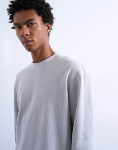 Model wearing Cropped fit long sleeve heavyweight waffle t-shirt in grey