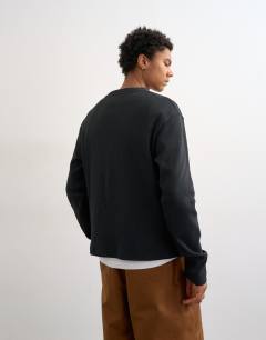 Model wearing Cropped fit long sleeve heavyweight waffle t-shirt in washed black
