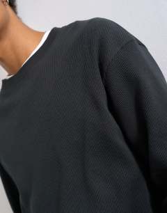 Model wearing Cropped fit long sleeve heavyweight waffle t-shirt in washed black