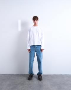 Model wearing Cropped fit long sleeve t-shirt in white