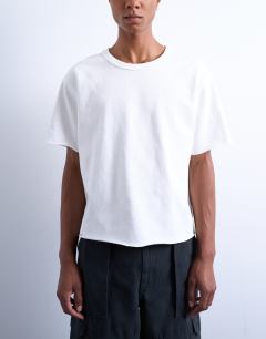 Model wearing Cropped fit slub raw edge tee in white