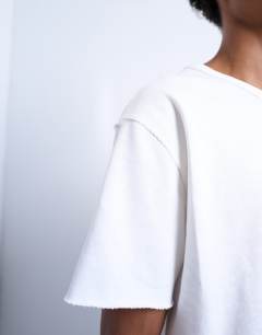 Model wearing Cropped fit slub raw edge tee in white