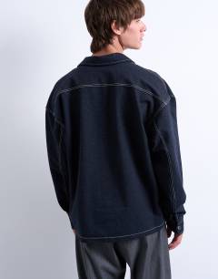 Model wearing Denim look jersey shacket in navy