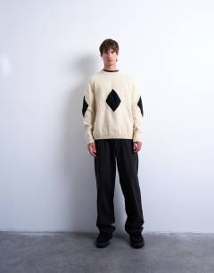 Model wearing Diamond knitted jumper in ecru