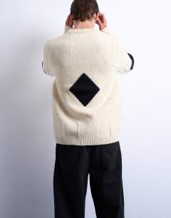Model wearing Diamond knitted jumper in ecru