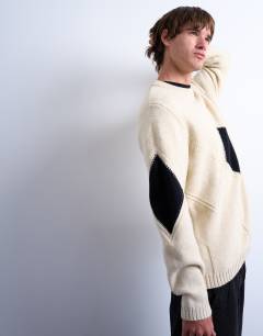 Model wearing Diamond knitted jumper in ecru