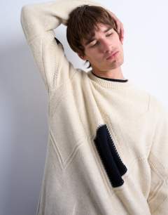 Model wearing Diamond knitted jumper in ecru