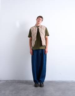 Model wearing Diamond quilt gilet in stone