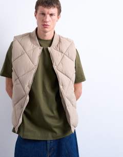 Model wearing Diamond quilt gilet in stone