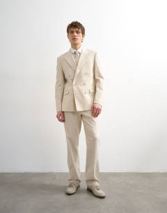Model wearing Double breasted linen rich blazer in stone