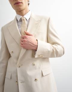 Model wearing Double breasted linen rich blazer in stone