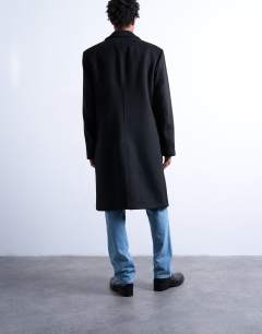 Model wearing Double breasted wool blend overcoat in black