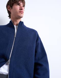 Model wearing Double zip funnel neck cardigan in navy