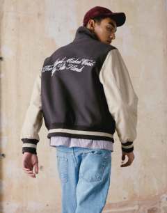 Embroidered varsity jacket in brown