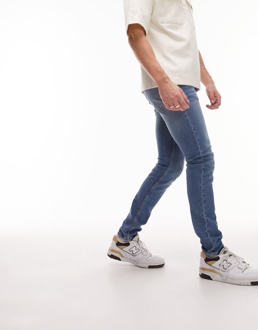 Topman – Eng geschnittene Stretch-Jeans in mittelblauer Waschung 