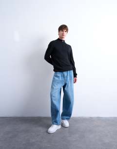 Model wearing Essential 1/4 zip funnel with wool in black