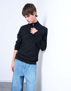 Model wearing Essential 1/4 zip funnel with wool in black