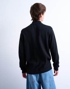 Model wearing Essential 1/4 zip funnel with wool in black