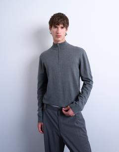Model wearing Essential 1/4 zip funnel with wool in charcoal
