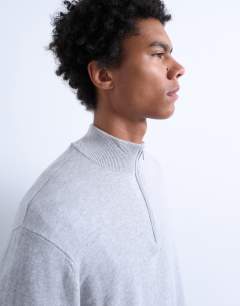 Model wearing Essential 1/4 zip funnel with wool in light grey