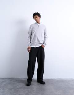 Model wearing Essential 1/4 zip funnel with wool in light grey