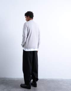 Model wearing Essential 1/4 zip funnel with wool in light grey