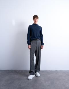 Model wearing Essential 1/4 zip funnel with wool in navy