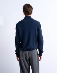 Model wearing Essential 1/4 zip funnel with wool in navy