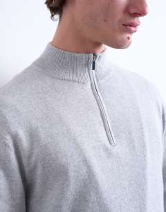 Model wearing Essential knitted 1/4 zip funnel in light grey