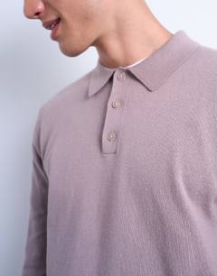 Model wearing Essential knitted button polo in dusty mauve
