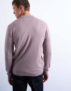 Model wearing Essential knitted button polo in dusty mauve